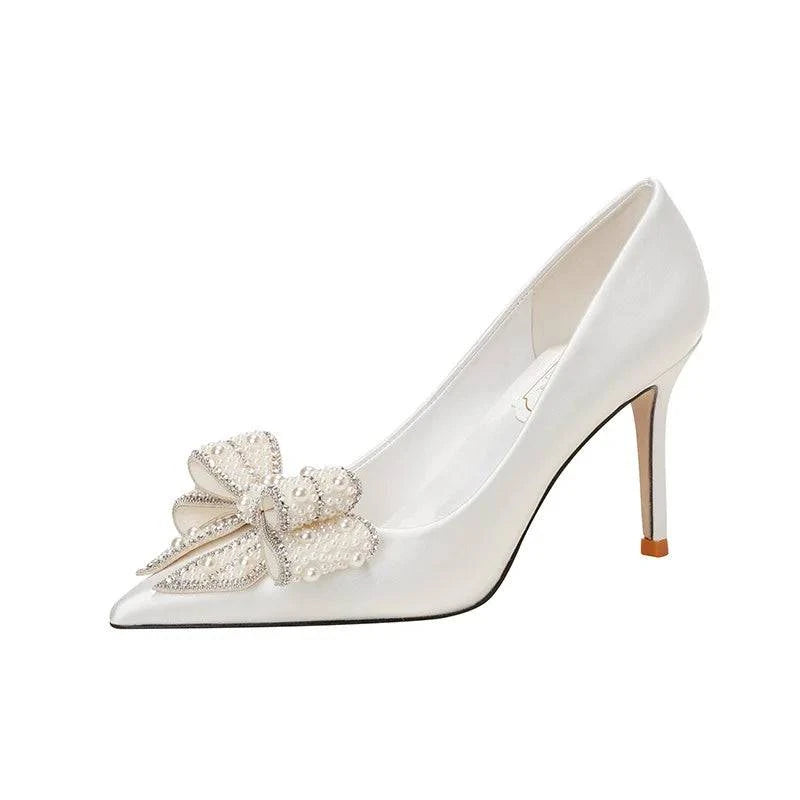White satin stiletto high heels with pointed toe, pearl bow detail for brides by LYNHURD!