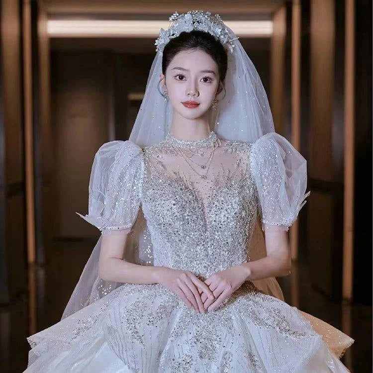 Elegant LYNHURD! wedding gown with chapel train, designed for brides at wedding parties, showcasing luxurious details.