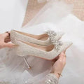 LYNHURD women's pointed toe wedding shoes with crystal accents and high heels, featuring a polyurethane sole and rubber heel.