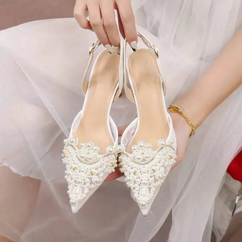 White lace high heels with pearl accents for bridesmaids by LYNHURD, showcasing elegant wedding footwear design.