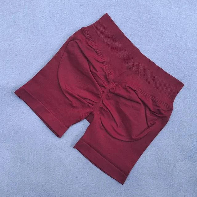 Women’s LYNHURD! yoga set featuring backless halter top and high waist seamless shorts in a stylish workout outfit.