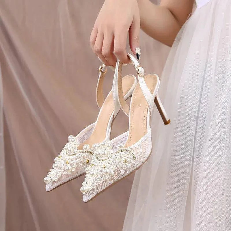 White lace high heel pumps with pearl accents for bridesmaids by LYNHURD, showcasing elegant design and stylish details.