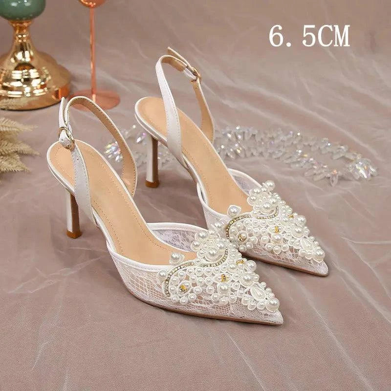 White lace high heel pumps with pearl embellishments for bridesmaids by LYNHURD, showcasing elegant wedding footwear.