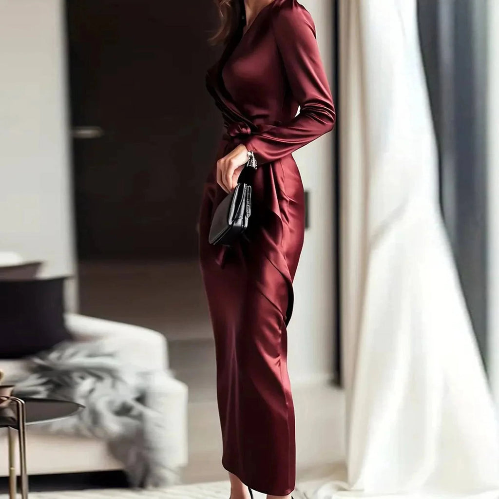 Women’s LYNHURD evening gown featuring a deep V-neck, long sleeves, and high slit in a bodycon maxi style.