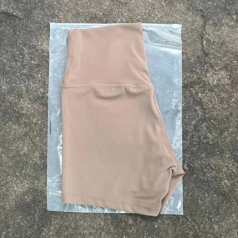 High waist LYNHURD! women's sports shorts in black, designed for yoga and running with a slim fit and butt lift feature.