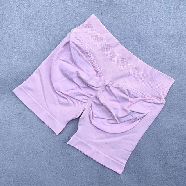 LYNHURD! women's yoga set featuring backless halter top and high-waist seamless shorts for fitness and workout activities.