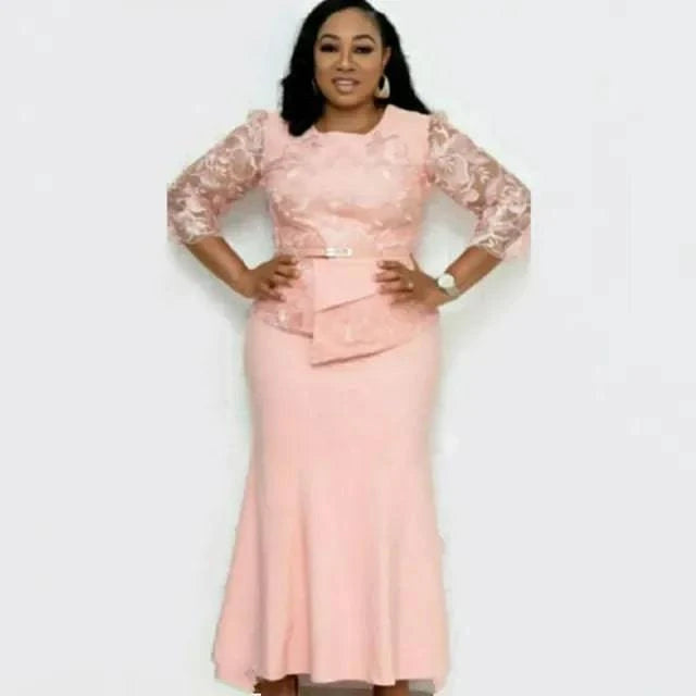 Plus size LYNHURD! Christmas dress featuring lace patchwork, 3/4 sleeves, and a long maxi design in a festive setting.