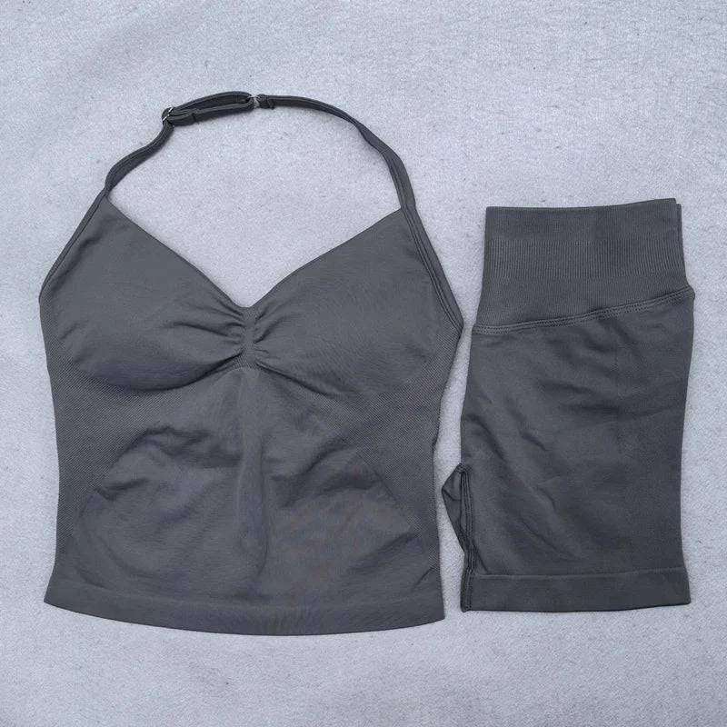Women's LYNHURD! yoga set featuring backless halter top and high waist seamless shorts for gym workouts.