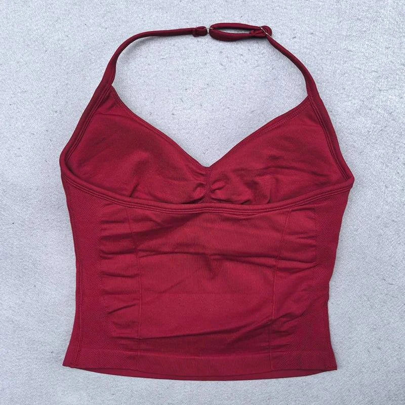 LYNHURD women's yoga set featuring backless halter top and high waist seamless shorts in a gym setting.