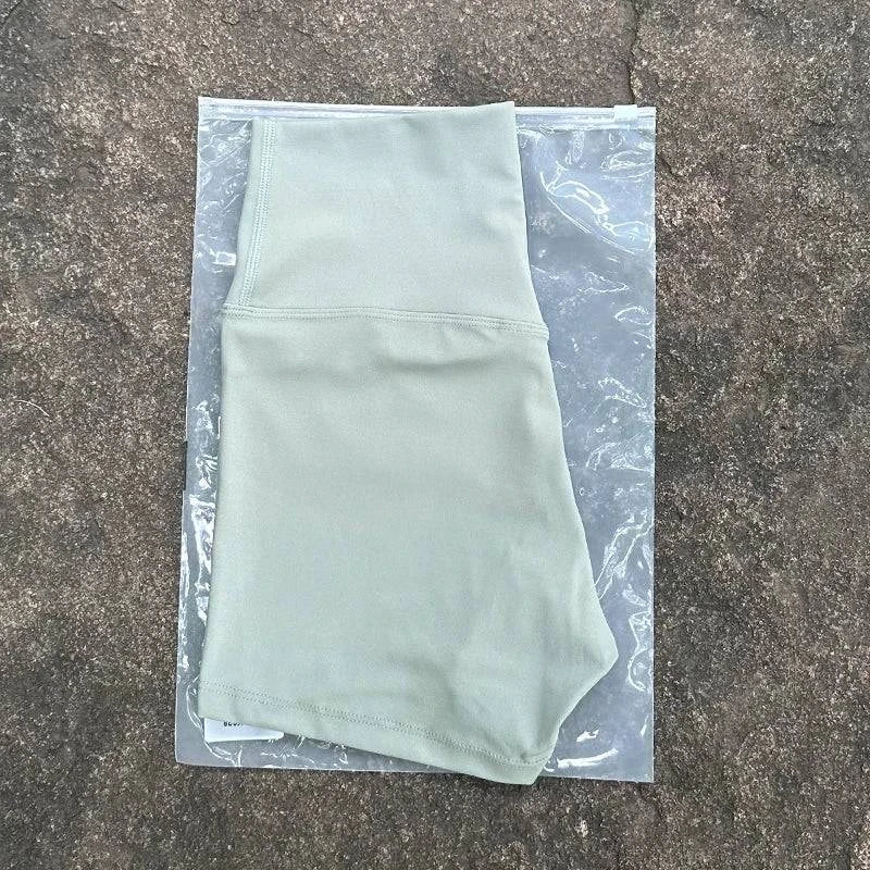 LYNHURD high waist yoga shorts in black, slim fit design with elastic fabric, ideal for gym and running activities.