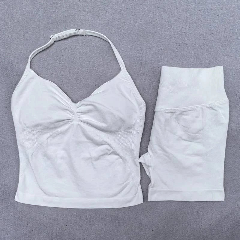 Women’s LYNHURD! yoga set featuring backless halter top and high-waist seamless shorts in a stylish gym outfit.